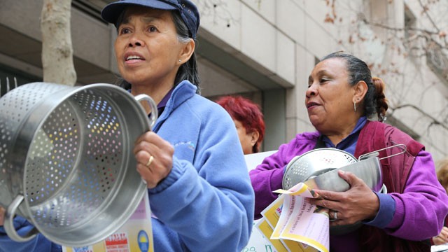 PHOTO: Domestic workers Amelia Barnachea (left) and Rosa Sanchez bang pots outside the State Building in downtown Los Angeles in support of AB 241 on March 7, 2013.