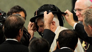 PHOTO: Pope Benedict XVI receives a hat as a gift from Italian Bersaglieri soldiers in Aula Paolo VI at the Vatican during his weekly general audience on September 15, 2010