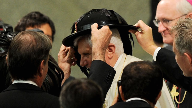 PHOTO: Pope Benedict XVI receives a hat as a gift from Italian Bersaglieri soldiers in Aula Paolo VI at the Vatican during his weekly general audience on September 15, 2010
