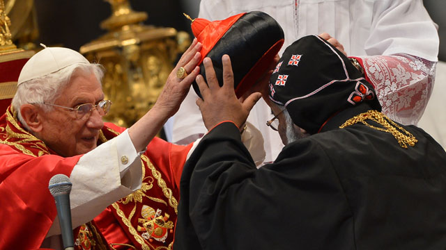 PHOTO: India's Baselios Cleemis Thottunkal receives his hat as Pope Benedict XVI (L) appoints him as a cardinal during a ceremony on November 24, 2012 at St Peter's basilica at the Vatican.