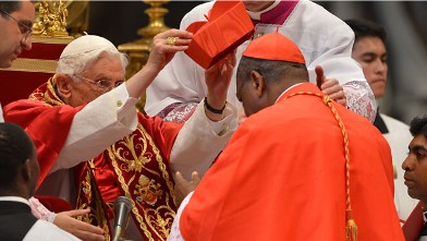 PHOTO: Nigeria's John Onaiyekan receives his biretta hat as Pope Benedict XVI (L) appoints him as a cardinal during a ceremony on November 24, 2012 at St Peter's basilica at the Vatican.