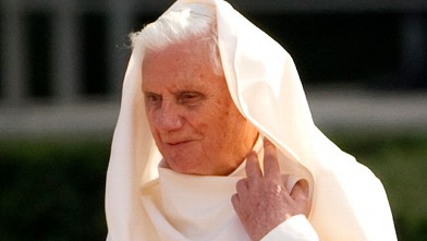 PHOTO: Pope Benedict XVI arranges his robe as he arrives at the Bellevue Palace on September 22, 2011 in Berlin, on the first day of his first state visit to his native Germany.