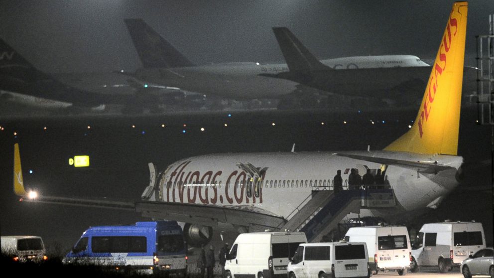 PHOTO: Turkish security officials enter the private Turkish company Pegasus plane before they evacuate passengers at the Sabiha Gokcen Airport in Istanbul, Turkey, Feb. 7, 2014.