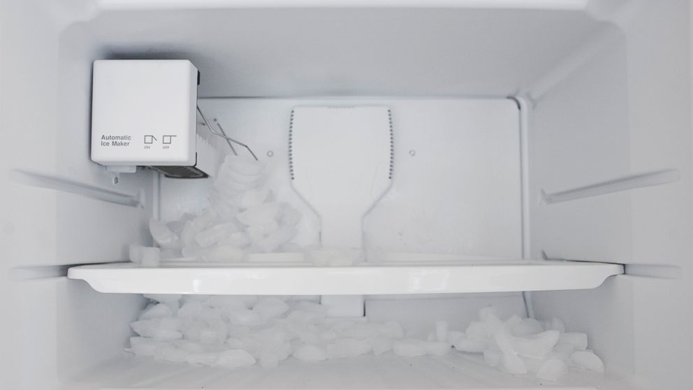 PHOTO: Ice spills out in a fridge as the automatic ice maker malfunctions.