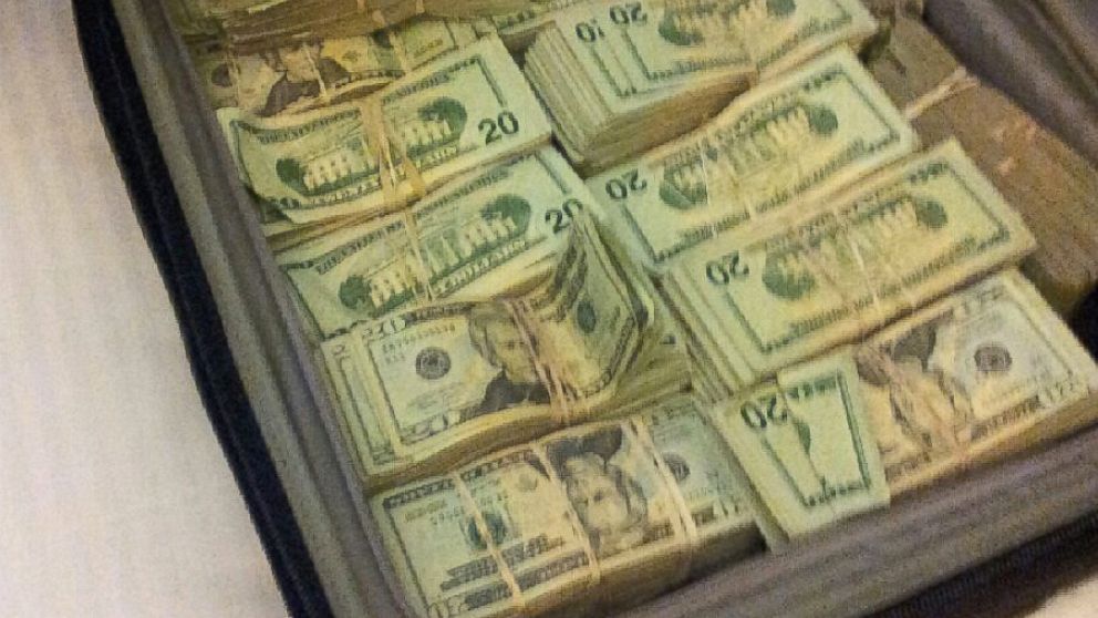 PHOTO:An image of a suitcase full of bundles of cash was entered as evidence against five men accused in a massive cyber heist.