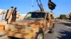 VIDEO: Video shows military convoy with flags similar to one used by terror group.
