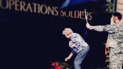 PHOTO: Woman lays down a rose