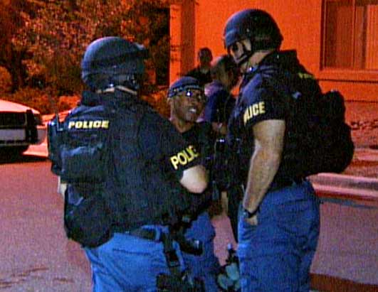 Photo: Behind the Scenes of a Kidnapping: Police try to rescue a victim in peril. 
