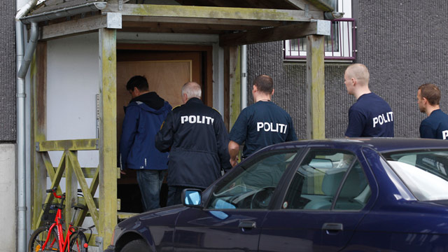 PHOTO: Danish police enter an appartment complex in Herlev, in the outskirts of Copenhagen, Denmark, for a search Friday, April 27, 2012.