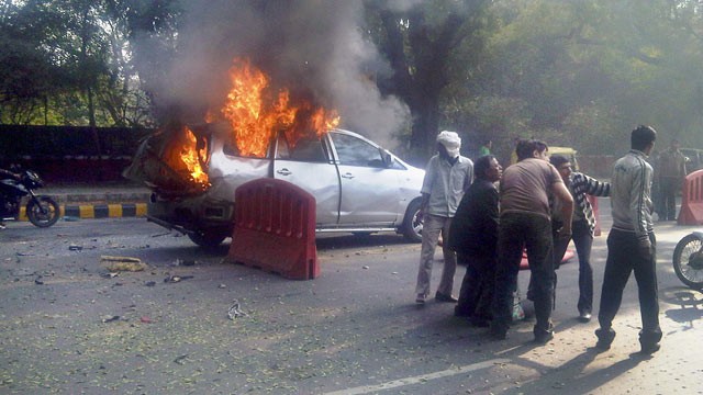 PHOTO: An injured person is carried from a burning car belonging to the Israeli Embassy following an explosion in New Delhi, India, Feb. 13, 2012.