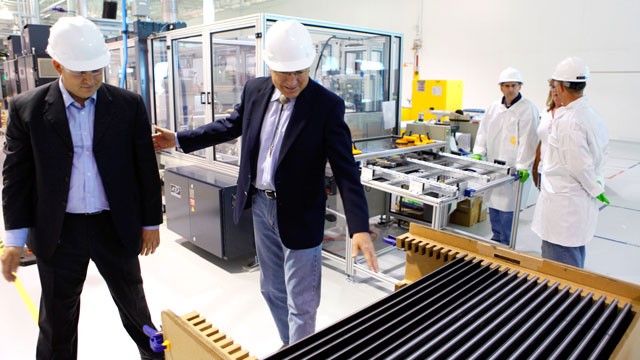 PHOTO: Abound Solar vice president Julian Hawkins, left, shows Secretary of the Interior Ken Salazar, second from left, finished solar panels during a tour of the solar manufacturing plant in Longmont, Colo., Aug. 4, 2009.