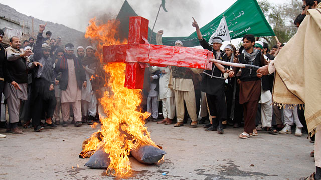 PHOTO: Afghans burn an effigy depicting the U.S. following the killing of civilians in Panjwai, Kandahar by a U.S. soldier during a protest in Jalalabad, Afghanistan, March 13, 2012.