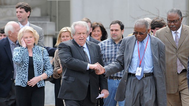 PHOTO: Casino owner Milton McGregor, center, shakes hands with attorney Fred Gray after McGregor and five other defendants were found not guilty on all counts in the gambling corruption trial at the Federal courthouse in Montgomery, Ala., March 7, 2012.