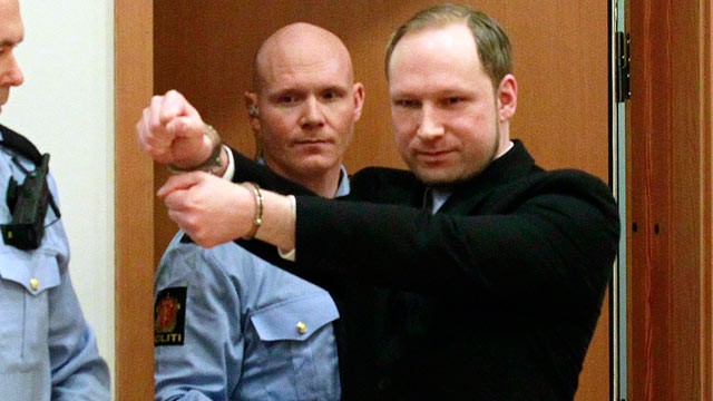 PHOTO: Anders Behring Breivik, a right-wing extremist who confessed to a bombing and mass shooting that killed 77 people, July 22, 2011, gestures as he arrives for a detention hearing at a court in Oslo, Norway, Feb. 6, 2012.