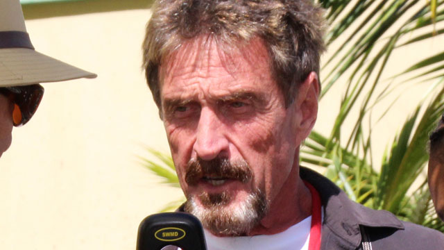 PHOTO: John McAfee speaks at the official presentation of equipment ceremony at the San Pedro Police Station in Ambergris Caye, Belize, Nov. 8, 2012. McAfee has been identified as a "person of interest" in the killing of his neighbor, Gregory Viant Faull.