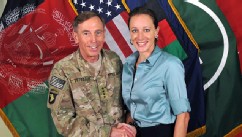PHOTO: Davis Petraeus, left, shaking hands with Paula Broadwell, co-author of  