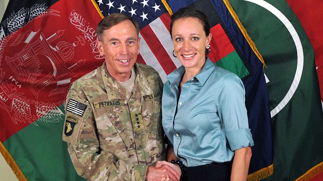PHOTO: Davis Petraeus, left, shaking hands with Paula Broadwell, co-author of