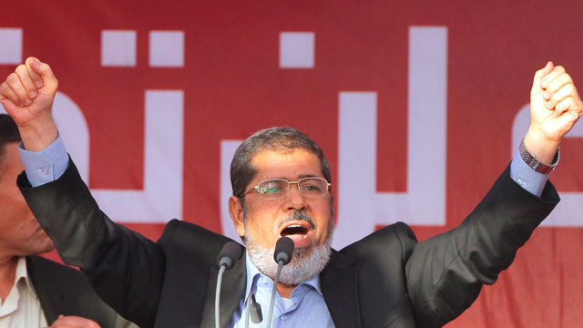 PHOTO: Egypts President-elect Mohammed Morsi talks to his supporters at Tahrir Square, the focal point of Egyptian uprising, during his speech in Cairo, Egypt, June 29, 2012.