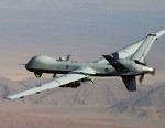 An MQ-9 Reaper, armed with GBU-12 Paveway II laser guided munitions and AGM-114 Hellfire missiles, is piloted by Col. Lex Turner during a combat mission over southern Afghanistan, in this undated photo.