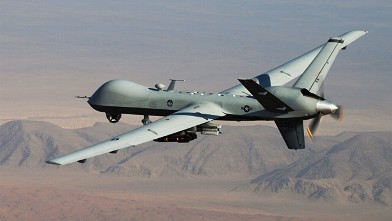 An MQ-9 Reaper, armed with GBU-12 Paveway II laser guided munitions and AGM-114 Hellfire missiles, is piloted by Col. Lex Turner during a combat mission over southern Afghanistan, in this undated photo.