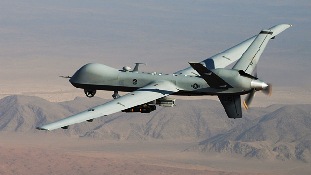 An MQ-9 Reaper, armed with GBU-12 Paveway II laser guided munitions and AGM-114 Hellfire missiles, is piloted by Col. Lex Turner during a combat mission over southern Afghanistan, in this undated photo.