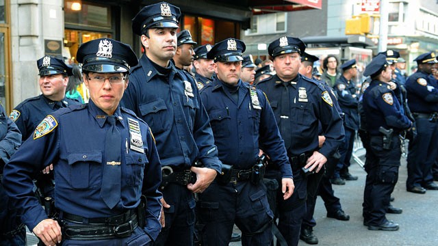 PHOTO: Police keep watch as protesters stage a protest in New York, May 1, 2012.