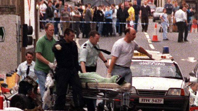 PHOTO: A body is removed from the scene shortly after a car bomb exploded in Omagh Co Tyrone, Northern Ireland, Aug. 15, 1998.