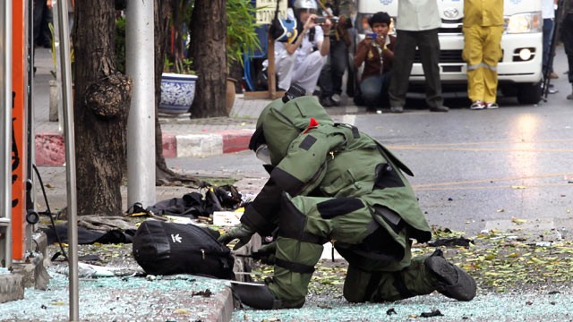 PHOTO: A Thai Explosive Ordnance Disposal (EOD) official examines a backpack that was left on the bomb site by a suspected bomber in Bangkok, Thailand, Feb. 14, 2012.