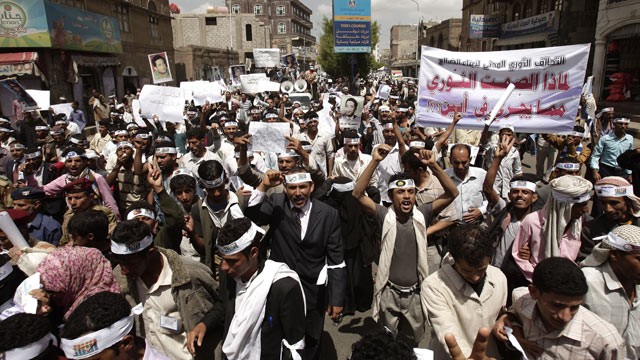PHOTO: Yemeni members of the Peaceful Revolution Salvation Front chant slogans during a demonstration demanding independence of the judicial system from government control, in Sanaa, Yemen, April 23, 2012.