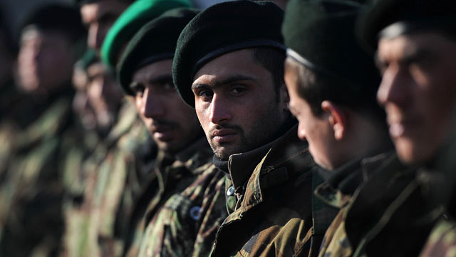PHOTO: Newly graduated Afghan National Army soldiers attend their graduation ceremony in Kabul on January 26, 2012.