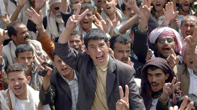 PHOTO: Flashing the V-sign for victory, anti-government protesters shout slogans during a rally to demand the trial for Yemen's outgoing President Ali Abdullah Saleh in Sanaa, Jan. 16, 2012.