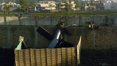 PHOTO: A crashed military helicopter is seen near the hideout of Al-Qaeda leader Osama bin Laden after a ground operation by US Special Forces in Abbottabad, May 2, 2011.