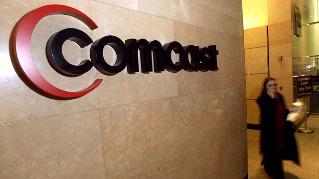 PHOTO: A Comcast logo hangs in the lobby of their corporate headquarters in Philadelphia.