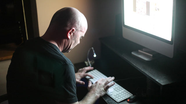 PHOTO: In this file photo, a man works on a computer.