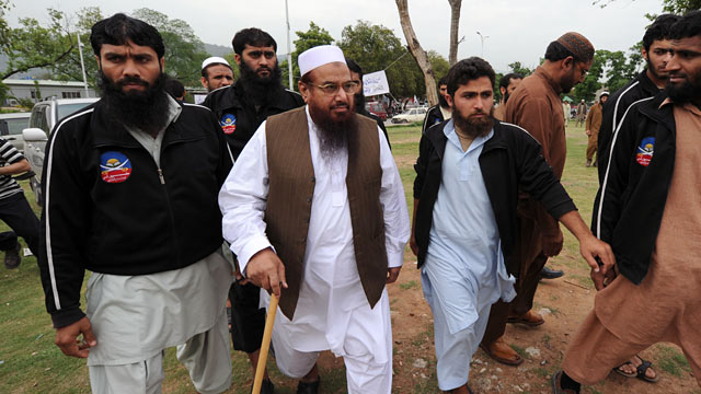 PHOTO: Chief of the Pakistan's outlawed Islamic hardliner Jamaat ud Dawa and Hafiz Mohammad Saeed, center, arrives to attend funeral prayers.