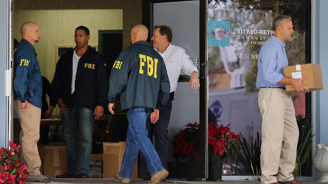 PHOTO: FBI agents and other law enforcement officials investigate the medical-office complex of Dr. Salomon Melgen who has possible ties to U.S. Sen. Bob Menendez (D-NJ) on January 30, 2013 in West Palm Beach, Fla.