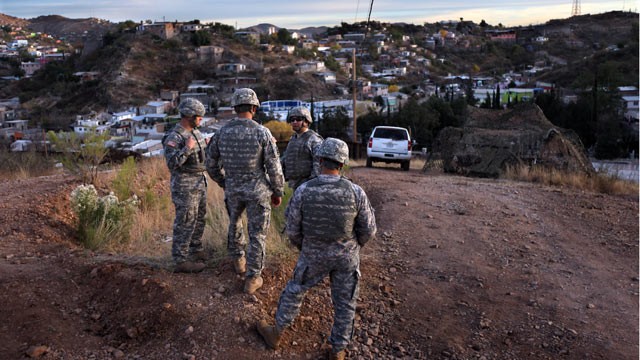 PHOTO: Arizona National Guardsmen talk while at an observation post overlooking the U.S. Mexico border in Nogales, Arizona.