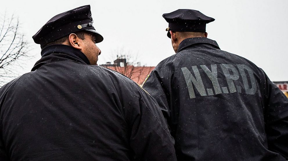 PHOTO: New York Police Department officers monitor a march against stop-and-frisk tactics used by police on February 23, 2013 in New York City.