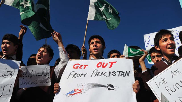 PHOTO: Pakistani students shout slogans during a protest outside the US consulate in Peshawar, Nov. 30, 2011, against the cross-border NATO air strike on Pakistani troops.