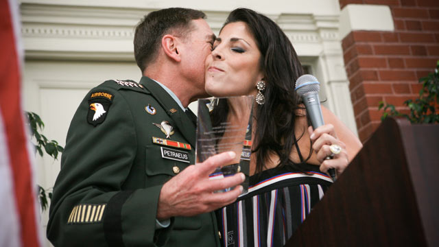PHOTO: General David Petraeus kisses Jill Kelley after accepting community service award presented at Kelleys home during the summer of 2011.