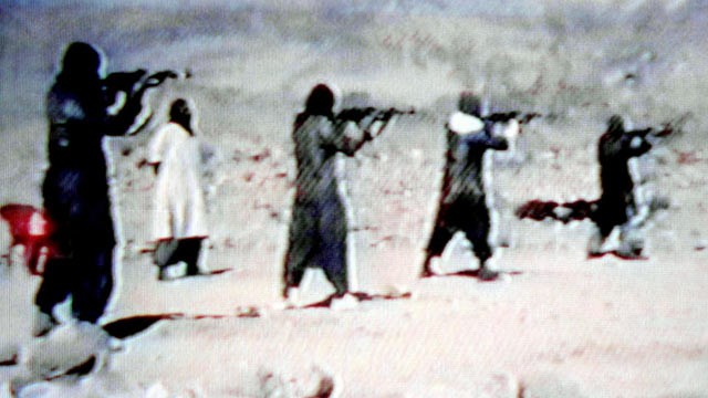 PHOTO: Members of Al-Qaeda are seen training with AK-47 sub-machine-guns in a video tape, June 19, 2001.