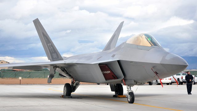PHOTO: An Air Force F-22 Raptor sits in front of the new Fuel Composite Overhaul Test Facility at Hill Air Force Base, Utah.