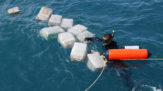 PHOTO: Diver recovering bales of cocaine
