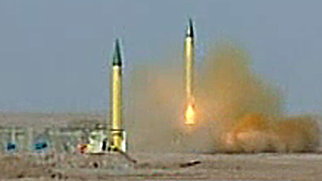 PHOTO: Irans Islamic Revolution Guards Corps shot off missiles during a televised military drill.