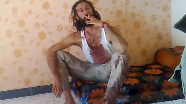 PHOTO: After the reported death of Libyan dictator Moammar Gadhafi and his son Mutassim, several cell phone videos surfaced online purportedly showing the two separately alive and in rebel custody. The above is a screengrab from one such video.