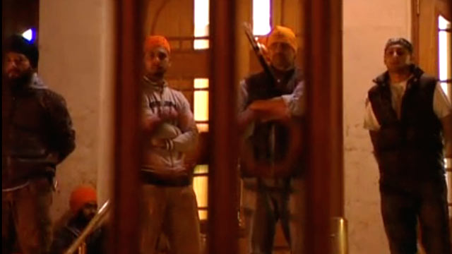 PHOTO: Southall Sikhs stand against rioters.