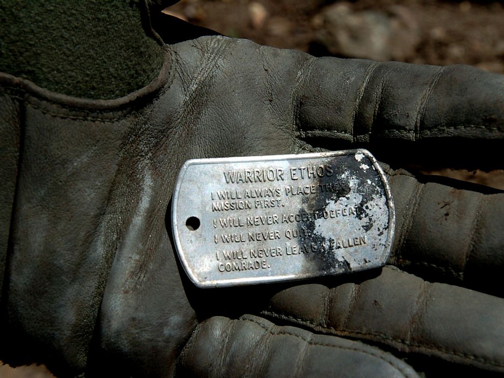 PHOTO: A dog tag with the Warrior Ethos inscribed on it, discovered in the wreckage of a shot down MH-47 helicopter in Operation Red Wings on June 28, 2005.