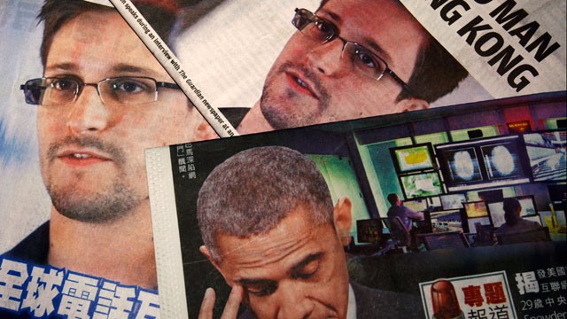 PHOTO: Photos of Edward Snowden, a contractor at the National Security Agency (NSA), and U.S. President Barack Obama are printed on the front pages of local English and Chinese newspapers in Hong Kong in this illustration photo June 11, 2013.