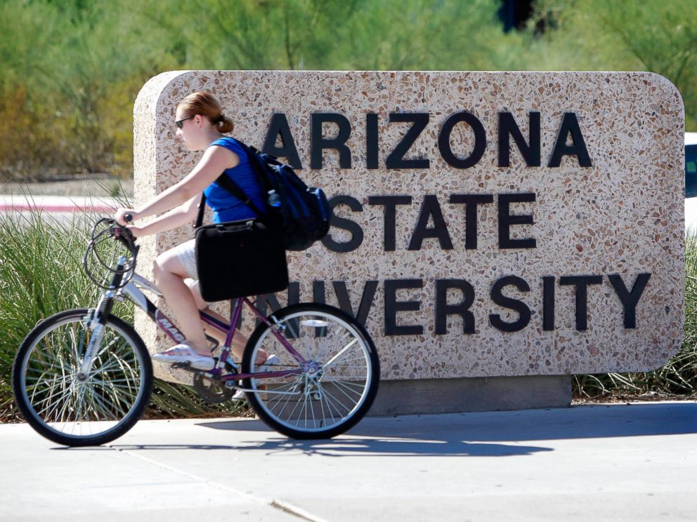 PHOTO: A student rides through the Arizona State University campus, Sept. 23, 2010, in Tempe, Ariz.