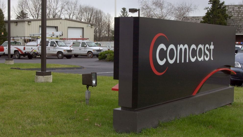 PHOTO: Comcast Cable installation trucks are seen parked at the Comcast facility in Sellersville, Pa., Dec. 20, 2001.